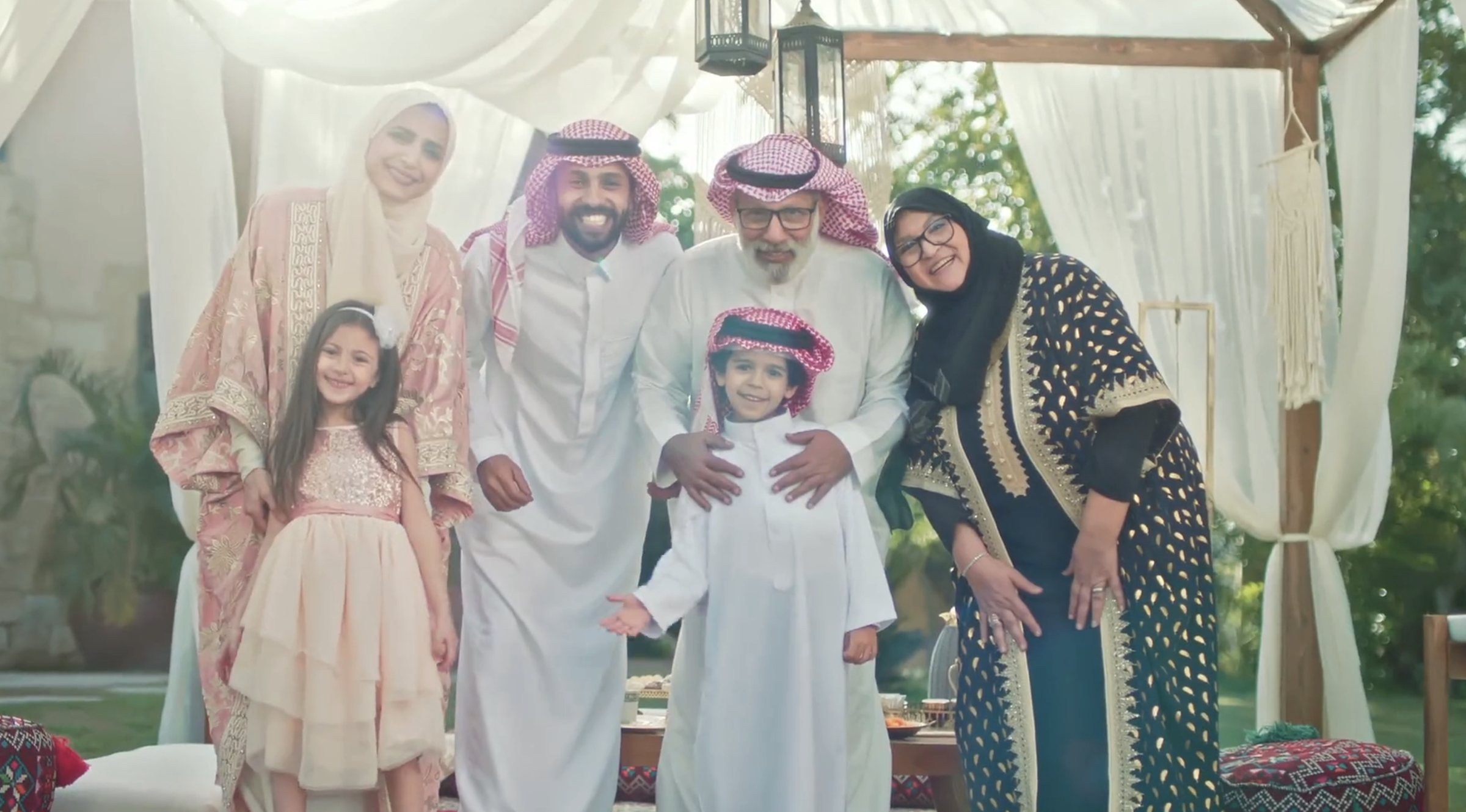 Saudi family smiling together outdoors